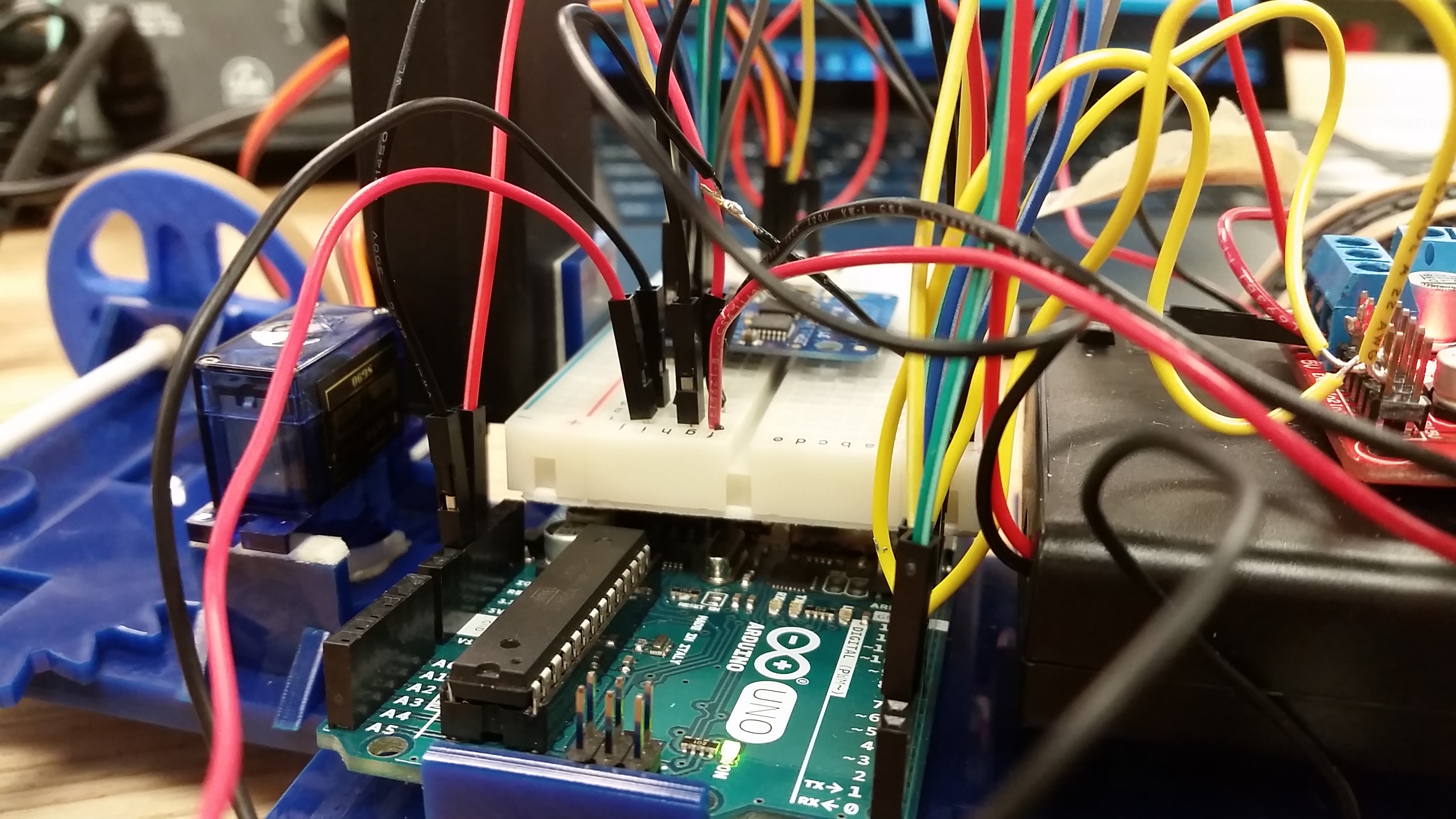 program servo motor arduino to rotate left by 30 degree